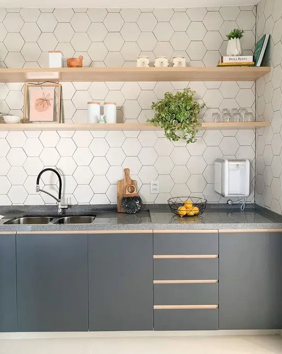 A stylish graphite grey one wall kitchen with a white hex tile backsplash and open blonde wood shelves.