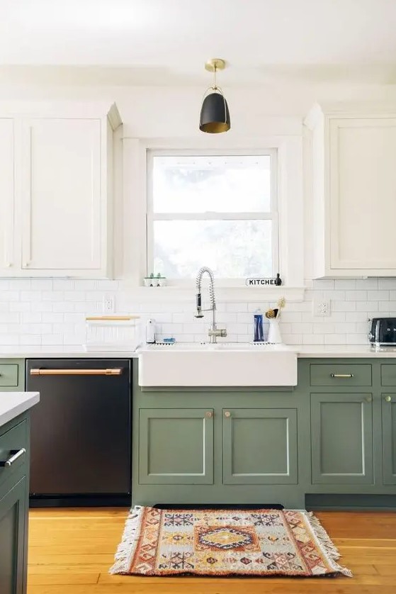 A two tone one wall kitchen with farmhouse cabinetry, a white subway tile backsplash, a white countertop and a black pendant lamp.