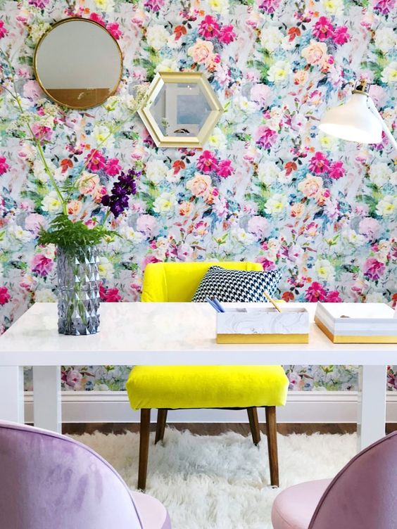 11 a colorful floral home office with a neon yellow chair, flowers in a vase and lilac chairs is a creative idea