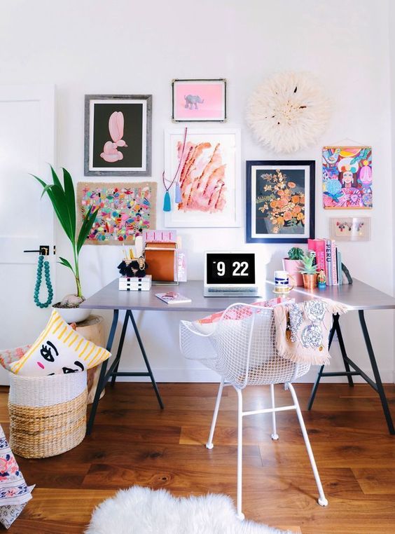 a cool home office refreshed for spring with a super colorful gallery wall, colorful pillows and books and potted plants