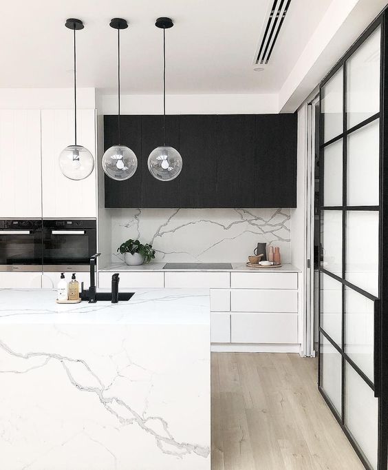a cool inimalist kitchen design with a marble kitchen island