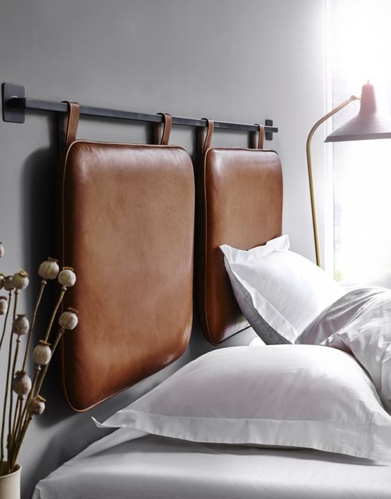 a creative suspended leather cushion headboard is a trendy idea that will add comfort to the bed