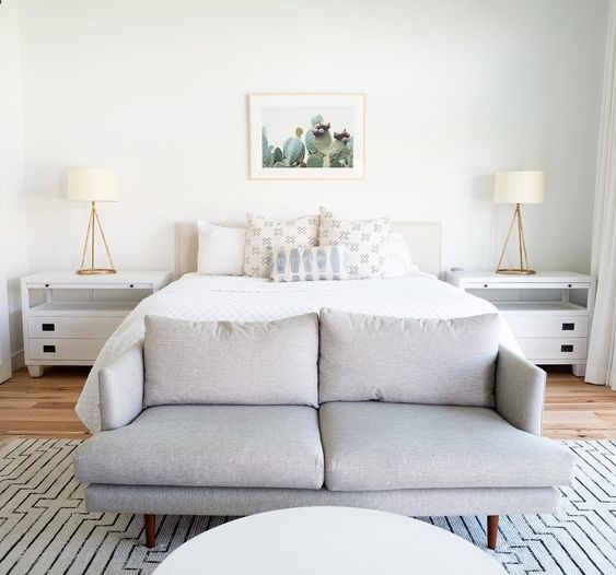 a dove grey modern loveseat doesn't stand out to much and matches the neutral and soothing bedroom decor