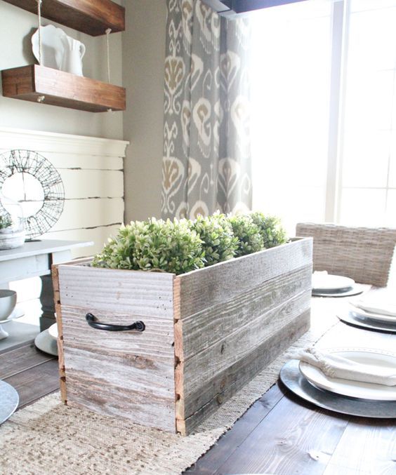 a relcaimed wooden box with boxwood is a simple farmhouse spring centerpiece that looks cozy and relaxed