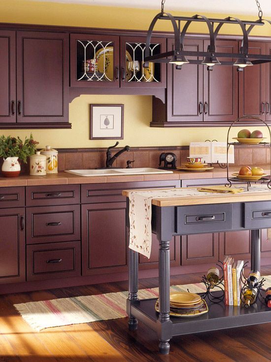 a vintage purple kitchen, buttermilk walls, a deep purple kitchen island and tile and butcherblock countertops