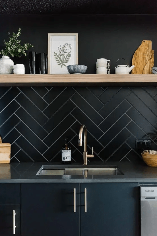 long and narrow tiles clad in a herringbone pattern with white grout that highlights them   a great contrasting idea