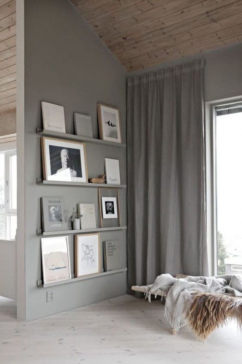 a stylish gallery wall with Ribba ledges matching the wall color to spruce up an awkward nook