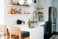 a cool white kitchen with navy cabinets, white stone countertops, open shelves, skinny tiles, a breakfast bar and tall stools