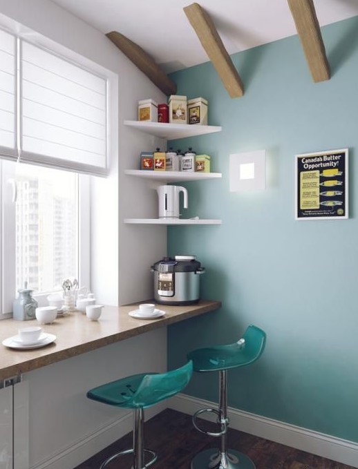 a cozy breakfast bar on the windowsill and a couple of modern teal stools is a lovely idea for a small space
