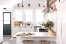 a cute kitchen design in white tones