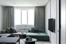 15 a lovely minimalist living room with a green and grey sofa, grey and green pillows, green curtains and chic furniture