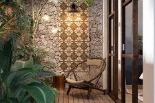 32 a tiny refined backyard with a wooden deck, tall stone walls and mosaic tiles for decor, a woven chair and some cool plants and trees