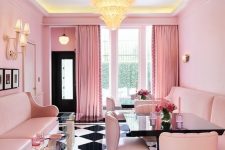 a catchy retro-inspired pink dining room with pink walls, sofas and chairs, with a gorgeous chandelier, a checked floor and elegant glass side tables