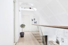a stylish attic space with hardwood flooring