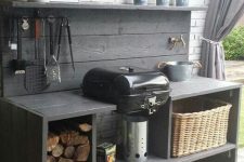 a cute outdoor summer kitchen with a girll