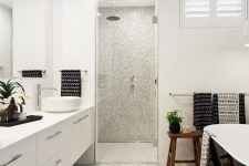 a stylish white bathroom with durable flooring