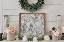 a greenery wreath always looks great above a mantel