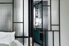 a beautiful patterned glass and black metal sliding door is a cool idea for a modern or Scandinavian home