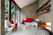 a cool living room design with concrete walls