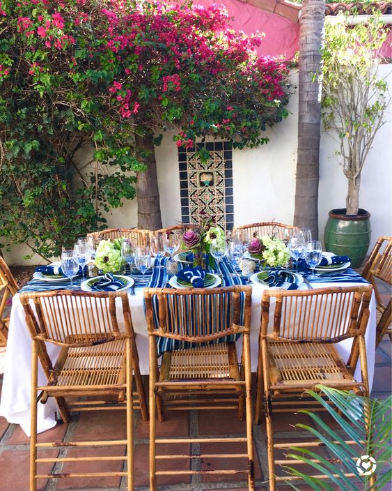 a bright Mediterranean dining zone with bold textiles and cool bamboo chairs that add a relaxed feel to the space