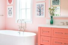 a lovely bathroom with pink walls