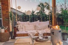 a lovely boho porch design with a hanging bed