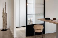 a modern black metal and glass sliding door is a stylish solution that can also fit a contemporary, Scandinavian space