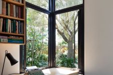 a cozy home office with a garden view