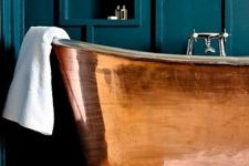 a polished copper bathtub with a chromatic faucet is a stylish and bright and shiny glam idea to rock