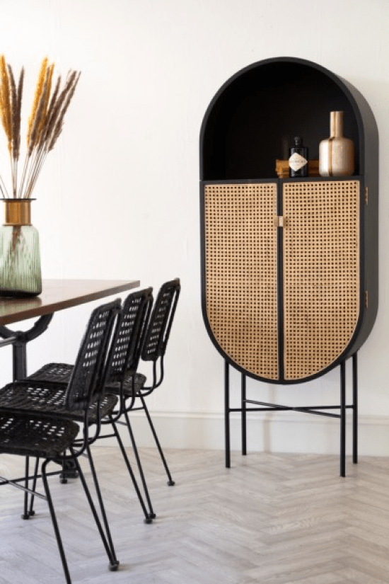 a refined black storage unit with cane doors is a very chic and gorgeous solution for any modern space, can be used as a bar or as a display unit
