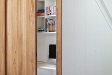 a sliding door is a nice way to hide a small home office
