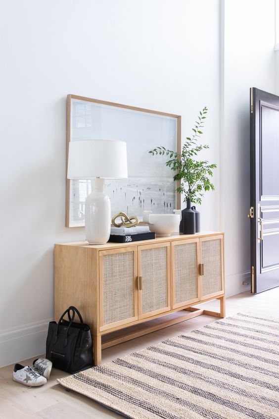 an elegant cane sideboard with cane doors is a lovely and stylish alternative to a usual console table in the entryway