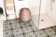 11 a cozy bathroom clad with white subway and smaller scale tiles, with green Moroccan tiles, a bamboo ladder, a basket for storage is cool