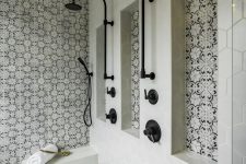 19 a stylish bathroom clad with grey hexagon tiles, black and white Moroccan tile accents and black fixtures is gorgeous
