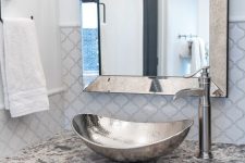 a cute bathroom design with arabesque tiled wall