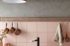 a cute eclectic kitchen design with pink tiles