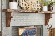 a painted brick fireplace covered with art