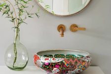 a bright painted vessel sink and brass fixtures will add color and pattern to any neutral bathroom and will make it look ultimate