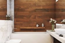 a chic bathroom clad with wood look tiles, with white appliances and a floating vanity plus skylights is a very cool space