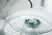 a chic clear glass vessel sink is a beautiful idea to enjoy those water waves and splashes and it looks lightweight and cool