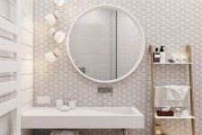 a trendy bathroom with hexagon tiled wall