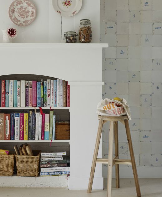 a faux fireplace with built-in bookshelves, with books, baskets and various stuff is a lovely alternative to a usual bookshelf in your space