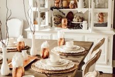 a lovely dining room accented with copper mugs and a hammered copper plate in the buffet is a very pretty and bright idea for a farmhouse space