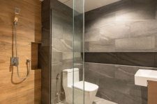 a minimalist bathroom clad with grey stone and wood look tiles in the shower, white appliances and lights is a lovely idea