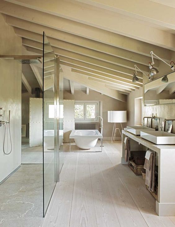 a neutral contemporary bathroom with a shower and a tub, a double vanity, wooden beams and vintage fixtures and lamps