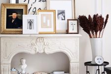 a refined fireplace with a gallery wall on the mantel, with books and statues inside it is a very chic and cool idea