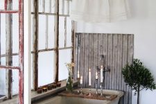 a shabby chic bathroom with shabby chic frames and wodoen beams, a concrete tub and corrugated stee, a potted tree is cool