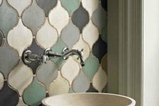 a sink space accented with multi-color matte arabesque tiles and a matte stone sink is a fantastic idea that looks inspiring and pretty