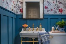 a stylish bathroom with a floral wallpaper
