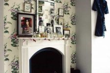 a vintage fireplace used for storing shoes and a mantel used for a pretty and bold gallery wall